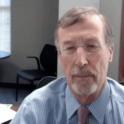 A man sitting at a desk in an office.