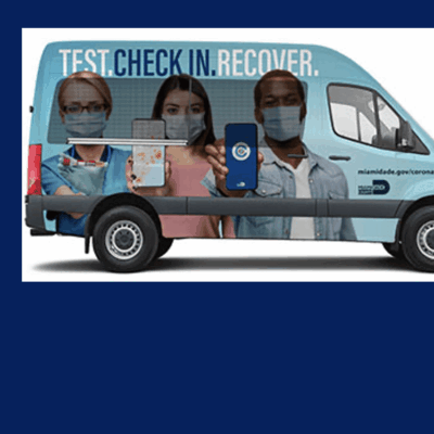 A blue van with the words test check in recovery.