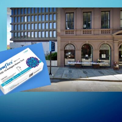 A picture of a building with a box in front of it.