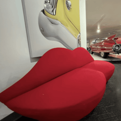 A red couch in a showroom.
