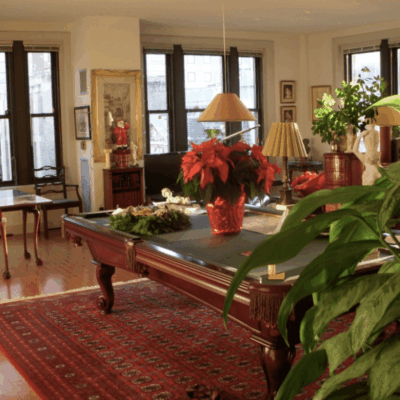 A pool table in a living room.