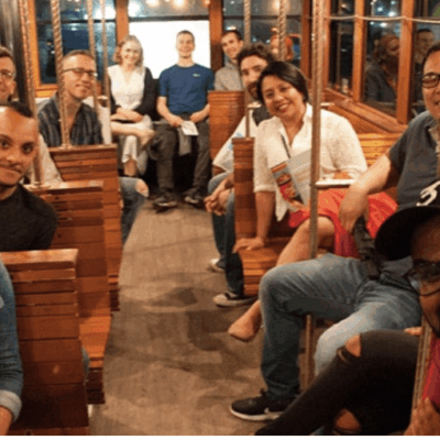 A group of people sitting on a train.