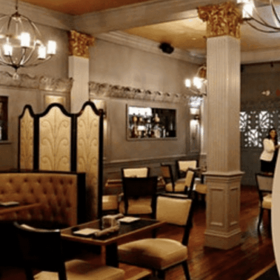 The interior of a restaurant with a chandelier.