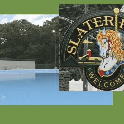 A sign for slater park with a pool in the background.