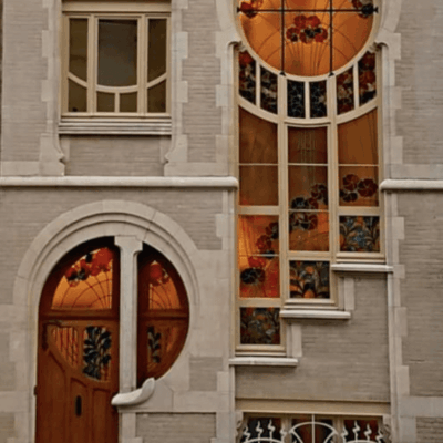 A house with a car parked in front of it.