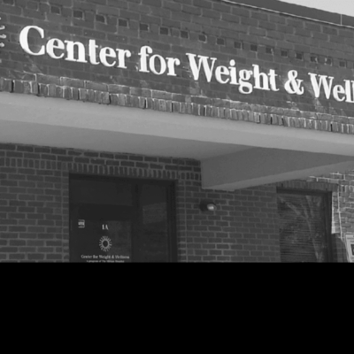 A black and white photo of the center for weight and wellness.