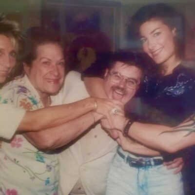 A photo of a group of women posing for a picture.