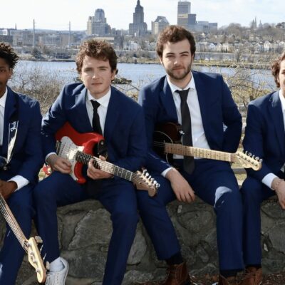 A group of men in blue suits posing for a photo.