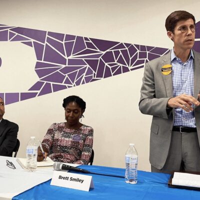 A group of people standing in front of a podium.