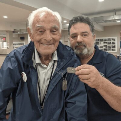 A man wearing a blue jacket.