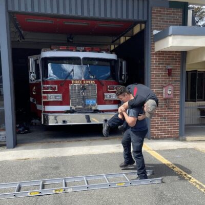 A fire truck in front of a building.