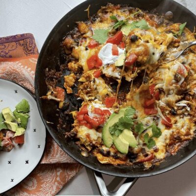 Mexican enchiladas in a skillet.