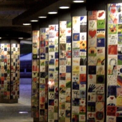 A hallway with a lot of colorful tiles on it.