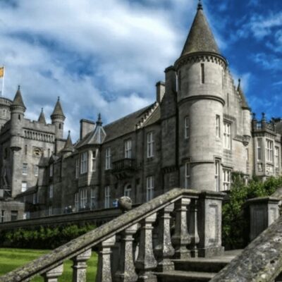 An ornate castle with stairs leading up to it.