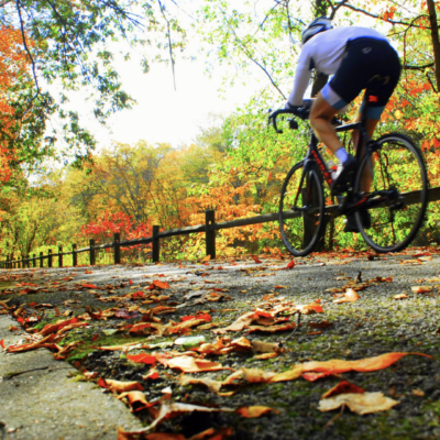 A person riding a bike on a path.