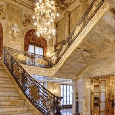 An ornate staircase in an ornate building.