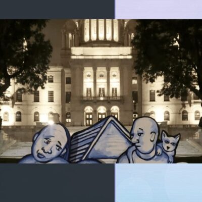 A picture of a man and a woman in front of a building.