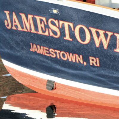 A boat docked in a body of water.