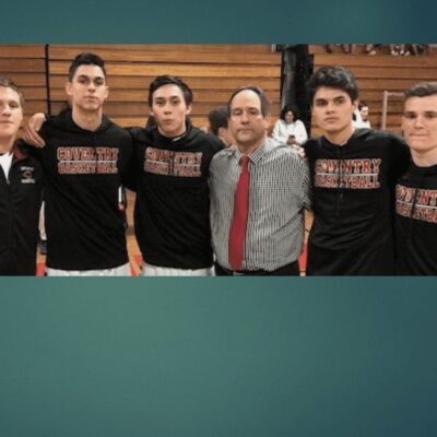 A group of basketball players posing for a picture.