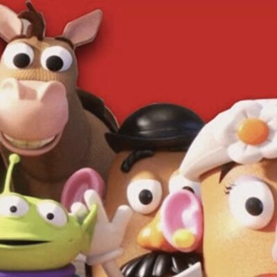 A group of toy story characters in front of a red background.