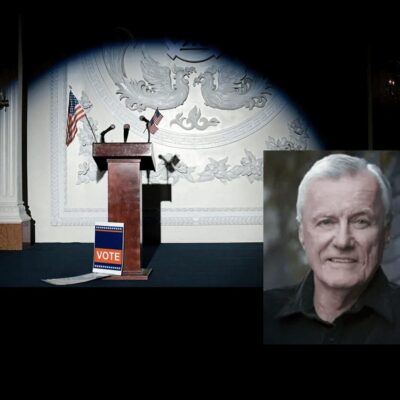 A photo of a man in front of a podium and an american flag.