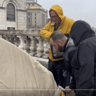 A group of people standing in front of a tent.