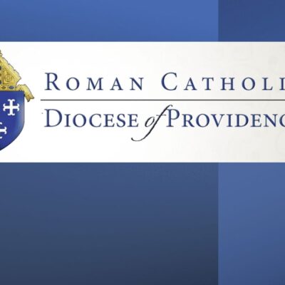 The roman catholic diocese of providence logo on a blue background.