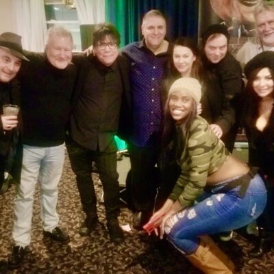 A group of people posing for a picture at a party.