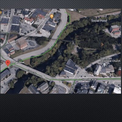 A map showing the location of a road and a river.