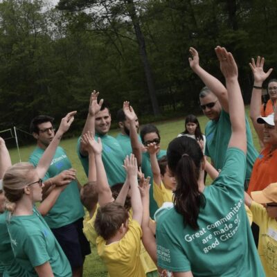 A group of people in matching shirts.