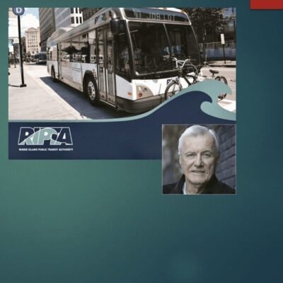 An image of a bus with a man in front of it.