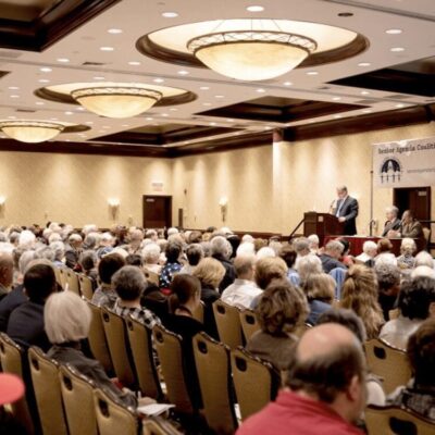 A large group of people in a room.