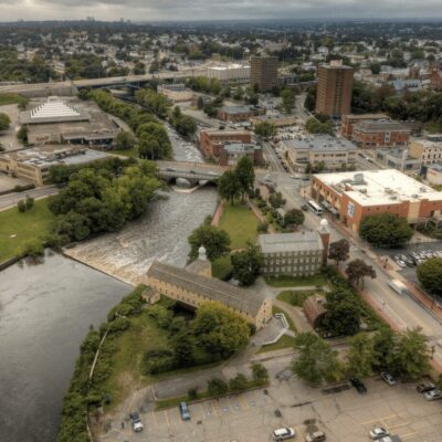 An aerial view of a city with a river.