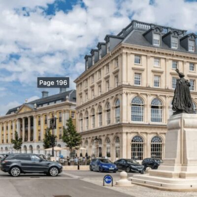 A city with impressive architecture, adorned with many towering buildings and a magnificent statue positioned prominently in the middle.