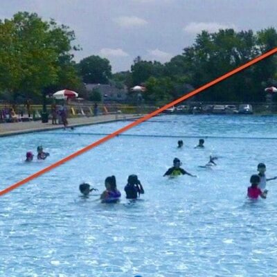 A group of people playing in a swimming pool.