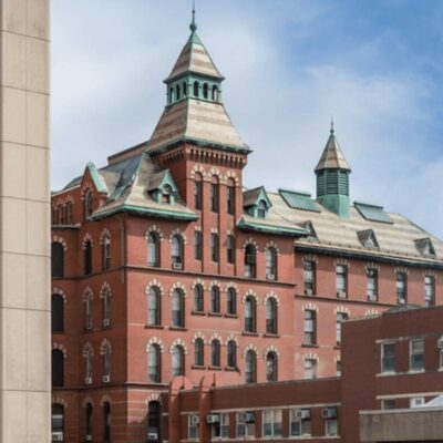 A large brick building with a clock tower.