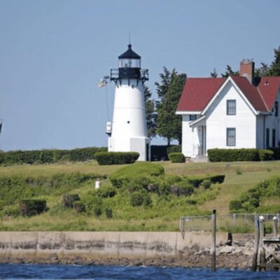 A lighthouse on top of a hill.