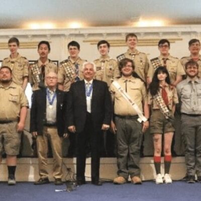 A group of Boy Scouts of America posing for a picture.