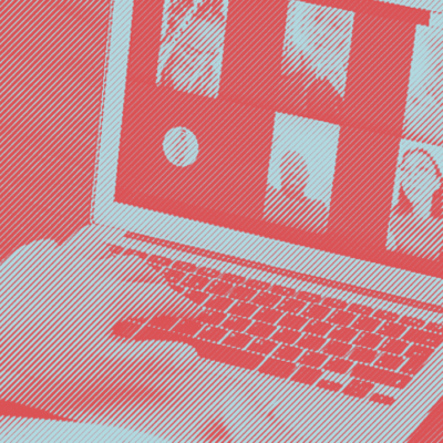 A person with accessibility needs is using a laptop.