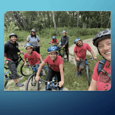 A biking group posing for a photo.