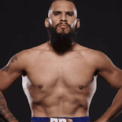 A bearded man posing for a photo.