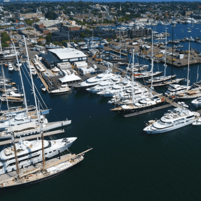 An aerial view of many yachts docked in the Newport Harbor.