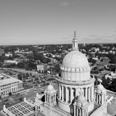 A black and white photo of a building with a dome.
