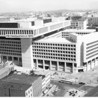 An old black and white photo showcasing the impressive architecture of a large building.