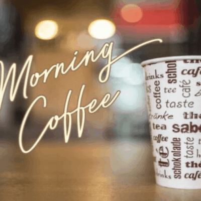 A cup of coffee with the words morning coffee on it.
