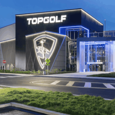The Topgolf building at dusk.