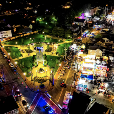 An aerial view of St. Mary's Feast, an amusement park at night.