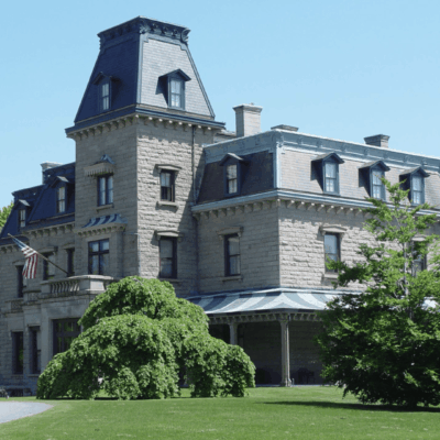 A grand Newport mansion, a sprawling stone building that is an epitome of architectural opulence.