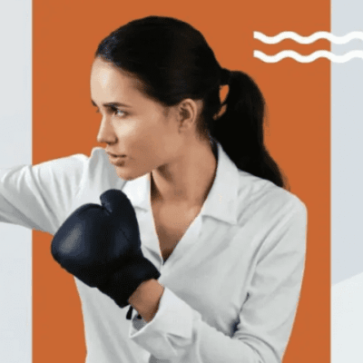 A woman in a white shirt is holding a boxing glove for exercise.
