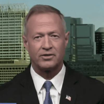 An image of a man in a suit and tie.